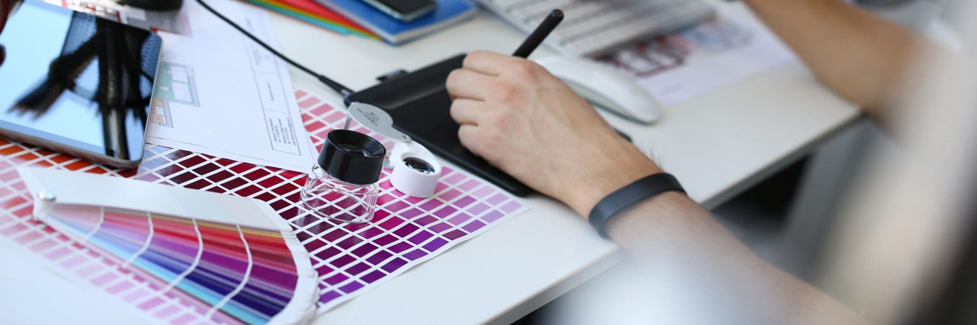Test print paper page with colour test design fantail and magnifying glass